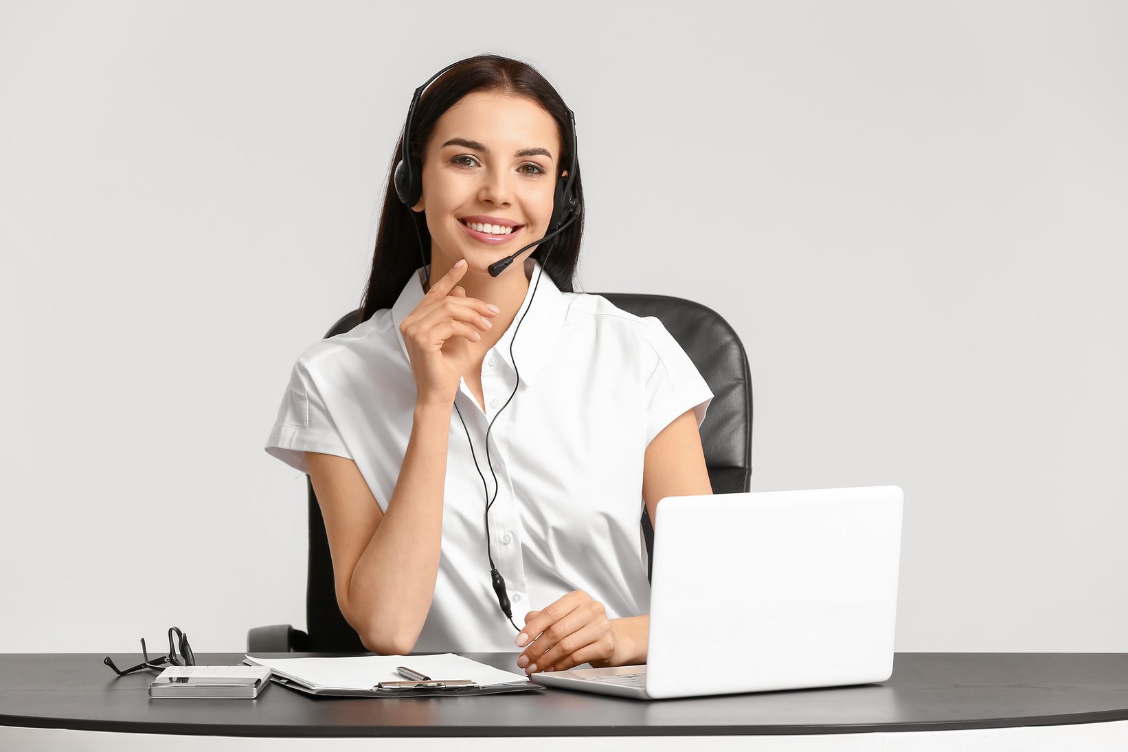 Female Telemarketer with Laptop and Headset